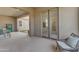 Relaxing covered patio with comfortable seating and views to the backyard's artificial turf at 4247 S Zenith --, Mesa, AZ 85212
