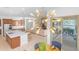 Well-lit dining area showcasing the modern lighting fixture and seamless access to outdoor space at 4247 S Zenith --, Mesa, AZ 85212