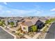 A home exterior with a brick driveway surrounded by desert landscaping and colorful plants at 4247 S Zenith --, Mesa, AZ 85212