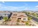An aerial view of a two-story home with a brick driveway and professionally landscaped yard at 4247 S Zenith --, Mesa, AZ 85212