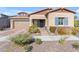 A beautiful single-Gathering home with desert landscaping, brown accents, and brick paved driveway at 4247 S Zenith --, Mesa, AZ 85212