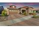 Charming home with a brick driveway, well-manicured landscaping, and a two-car garage at 4247 S Zenith --, Mesa, AZ 85212