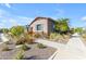 A well-manicured front yard adorned with colorful desert landscaping and a stone-lined walkway at 4247 S Zenith --, Mesa, AZ 85212