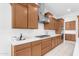 Spacious kitchen featuring wooden cabinets, white countertops, and stainless steel range hood at 4247 S Zenith --, Mesa, AZ 85212
