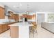 Open kitchen features white countertops, modern appliances, and barstool seating at the kitchen island at 4247 S Zenith --, Mesa, AZ 85212