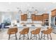 Bright kitchen with a central island, breakfast bar, and stainless steel appliances at 4247 S Zenith --, Mesa, AZ 85212