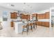 Spacious kitchen featuring an island with seating, stainless steel appliances, and modern pendant lights at 4247 S Zenith --, Mesa, AZ 85212