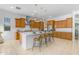 Bright kitchen with a central island, breakfast bar, and stainless steel appliances at 4247 S Zenith --, Mesa, AZ 85212