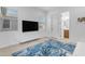 Modern living area with sleek TV console and bright, airy feel and adjacent bathroom at 4247 S Zenith --, Mesa, AZ 85212