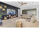 Spacious living room with large sectional sofa, modern decor, and bright window, creating an inviting gathering space at 4247 S Zenith --, Mesa, AZ 85212