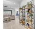 Open-concept living space with neutral sofa, stylish shelving, and access to the dining area, creating a welcoming atmosphere at 4247 S Zenith --, Mesa, AZ 85212