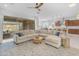 Bright living room featuring a large sectional sofa, stylish decor, and sliding glass doors at 4247 S Zenith --, Mesa, AZ 85212