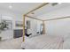 Spacious main bedroom with a designer bed frame, neutral rug, dresser, and a comfortable seating area at 4247 S Zenith --, Mesa, AZ 85212