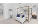 Bright main bedroom featuring a stylish bed frame, neutral rug and décor, with a comfortable seating area at 4247 S Zenith --, Mesa, AZ 85212