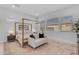 Bright main bedroom featuring a stylish bed frame, neutral rug and décor, with a comfortable seating area at 4247 S Zenith --, Mesa, AZ 85212