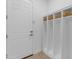 Bright mud room featuring built-in storage lockers with baskets for organization and an exterior door at 4247 S Zenith --, Mesa, AZ 85212