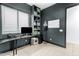Modern office featuring a black desk, built-in shelving, and neutral decor at 4247 S Zenith --, Mesa, AZ 85212