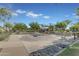 Inviting outdoor lounge area with concrete features and lush landscaping for relaxing at 4247 S Zenith --, Mesa, AZ 85212