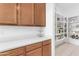 Spacious pantry with quartz countertops and well-organized shelving for easy access at 4247 S Zenith --, Mesa, AZ 85212