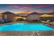 The backyard features a sparkling blue pool and cozy seating arrangements, perfect for relaxation at 4247 S Zenith --, Mesa, AZ 85212