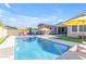 Inviting pool with pristine blue water, lounge chairs, umbrellas, and a lush green artificial lawn at 4247 S Zenith --, Mesa, AZ 85212
