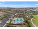 Aerial of a community pool area, featuring palm trees, lounge chairs, and ample parking for residents and guests at 4247 S Zenith --, Mesa, AZ 85212