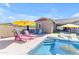Entertain in style with this backyard pool, seating, and lush turf at 4247 S Zenith --, Mesa, AZ 85212