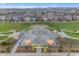 Aerial view of a vibrant skate park featuring ramps, shade structures, and a large grassy area at 4247 S Zenith --, Mesa, AZ 85212