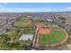 Aerial view of sports fields and playground, offering recreational opportunities for residents of all ages at 4247 S Zenith --, Mesa, AZ 85212