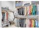 Well-organized walk-in closet with ample shelving, hanging space, and shoe racks for efficient storage at 4247 S Zenith --, Mesa, AZ 85212