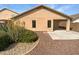 Low-maintenance backyard with desert landscaping and covered patio at 44271 W Oster Dr, Maricopa, AZ 85138