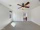 Clean bedroom with neutral carpet and natural light at 44271 W Oster Dr, Maricopa, AZ 85138