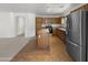 Open kitchen with stainless steel appliances and island at 44271 W Oster Dr, Maricopa, AZ 85138