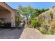 Landscaped backyard with brick pavers and cozy seating, great for relaxation at 4516 E Walter Way, Phoenix, AZ 85050