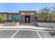 Community clubhouse featuring a stone facade, well-maintained landscaping, and ample parking for residents and guests at 4516 E Walter Way, Phoenix, AZ 85050