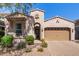 Charming home featuring stucco, tile roof, landscaped front yard, and a two-car garage at 4516 E Walter Way, Phoenix, AZ 85050