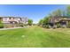 Green community lawn area surrounded by trees and residential buildings at 4516 E Walter Way, Phoenix, AZ 85050