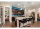 Well-appointed kitchen featuring a large island with bar seating, ample counter space, and a pantry at 4516 E Walter Way, Phoenix, AZ 85050