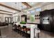 Modern kitchen with a large island, stainless steel appliances, and pendant lighting at 4516 E Walter Way, Phoenix, AZ 85050