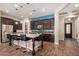 Stylish kitchen boasting a large island with bar seating, stainless steel appliances, and ample cabinet space at 4516 E Walter Way, Phoenix, AZ 85050