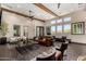 Bright living space with wood beams, stylish furniture, and plenty of natural light at 4516 E Walter Way, Phoenix, AZ 85050
