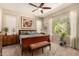 Serene primary bedroom with a ceiling fan, large window, and comfortable furnishings at 4516 E Walter Way, Phoenix, AZ 85050