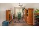 Cozy office space featuring vintage decor, a ceiling fan, and natural light from the window at 4516 E Walter Way, Phoenix, AZ 85050