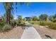Community park area with walking path surrounded by trees and green grass at 4516 E Walter Way, Phoenix, AZ 85050