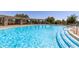 Inviting community pool with clear blue water, featuring easy access steps and plenty of space for swimming and recreation at 4516 E Walter Way, Phoenix, AZ 85050