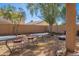 Cozy backyard with patio seating and barbecue grill, perfect for outdoor dining and entertaining at 5139 W Shumway Farm Rd, Laveen, AZ 85339