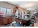 Functional kitchen featuring stainless steel appliances, granite counters, and a breakfast bar at 5139 W Shumway Farm Rd, Laveen, AZ 85339