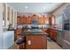 Well-equipped kitchen featuring granite countertops, stainless steel appliances, and a kitchen island at 5139 W Shumway Farm Rd, Laveen, AZ 85339