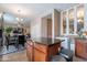 Modern kitchen with stainless steel appliances and island, seamlessly connects to the dining area at 5139 W Shumway Farm Rd, Laveen, AZ 85339