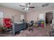 Spacious home office with a ceiling fan, a large desk, and comfortable chairs at 5139 W Shumway Farm Rd, Laveen, AZ 85339